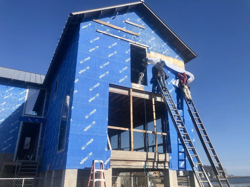 Contractors at work at 233 Hillspoint Road. / Photos by Thane Grauel