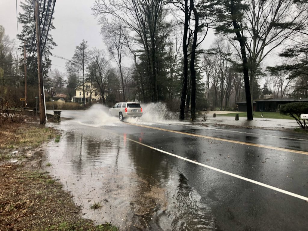 Muddy Brook overtops Greens Farms Road.