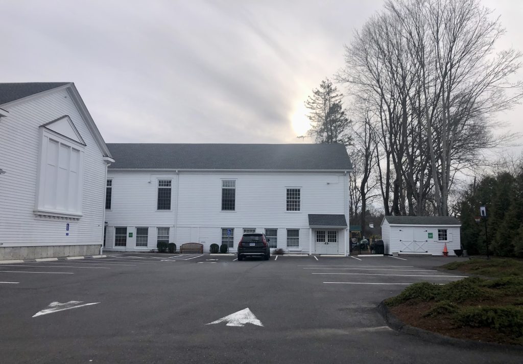 Parking area and storage shed.