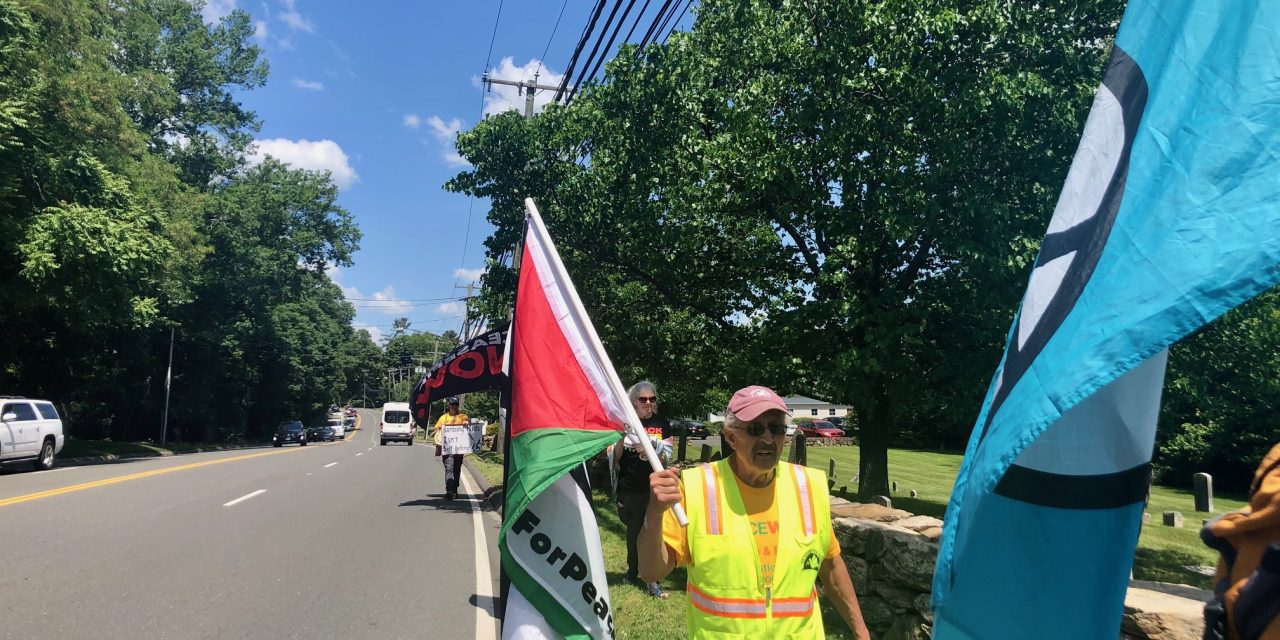 Group opposed to war walks through Westport