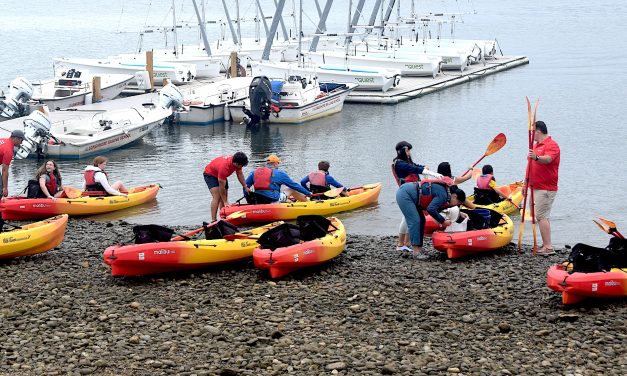 Shore looks better: Kayak flotilla buoys waterfront cleanup
