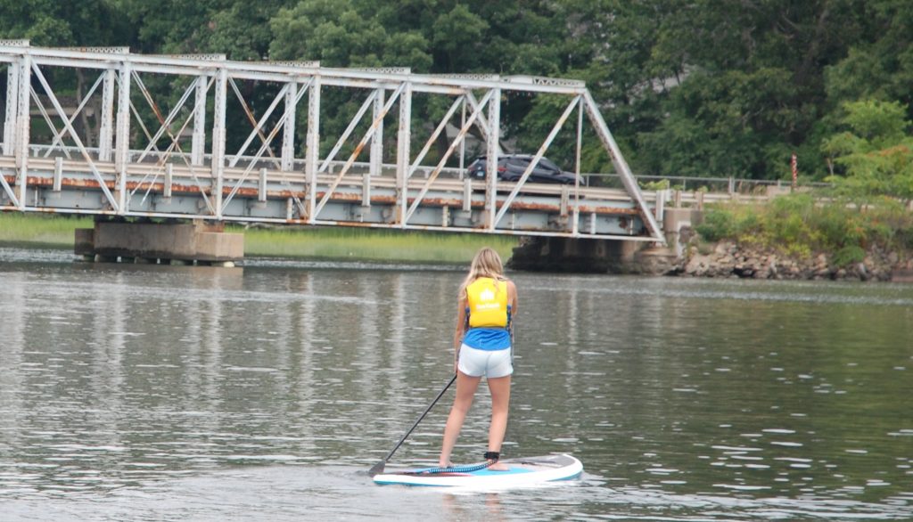 Kayaker heading for the Cribari Bridge in Saugatuck - Photo Sea Kayak Connecticut