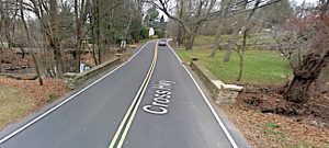 The stone bridge that carries Cross Highway over Deadman Brook will be replaced by a wider span.