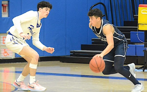 Staples boys unwrap new basketball season on winning note