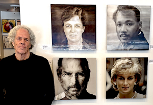 Miggs Burroughs with his lenticular artwork on display at the Westport Book Shop through Feb. 28.