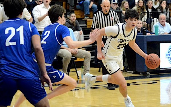 Staples boys tame Tigers in basketball regular season finale