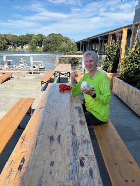 Chris Howe takes a break after kayaking on the Saugatuck