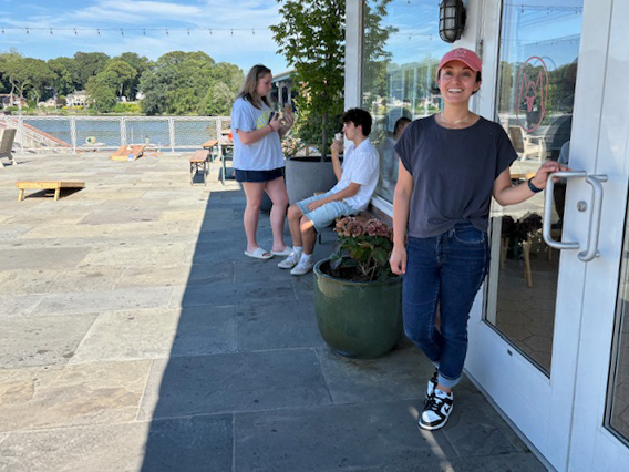 Emily Muñoz, front, and Staples High School juniors Autumn Kaye and Will Mezzullo