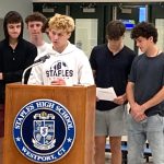 Staples soccer players show support, protest coach firings at school board meeting