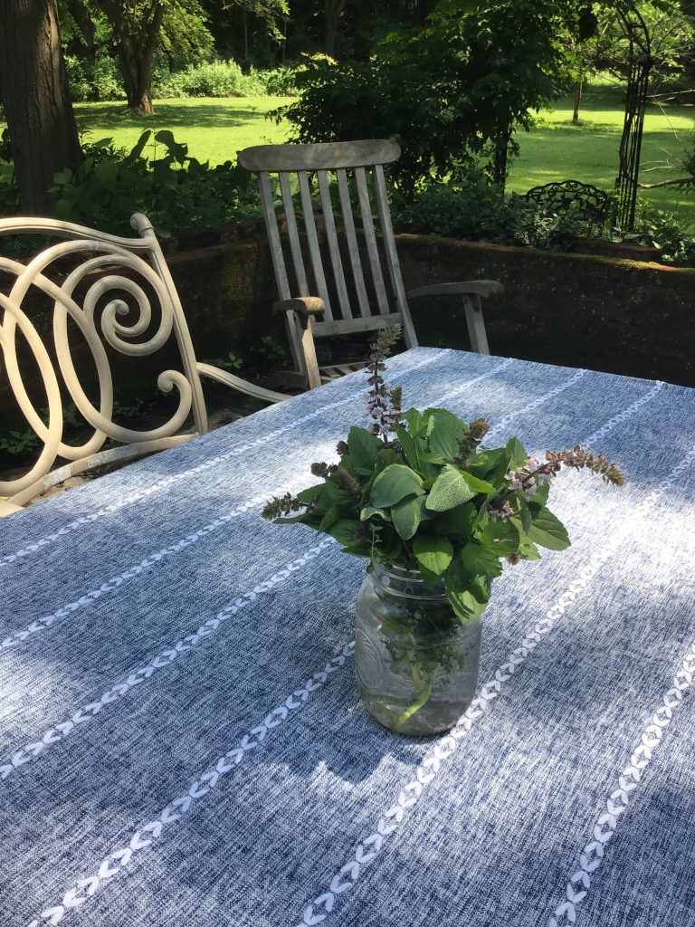 A few herbs snipped from Kerri’s garden and arranged in a mason jar make for a fun and fragrant summer centerpiece.