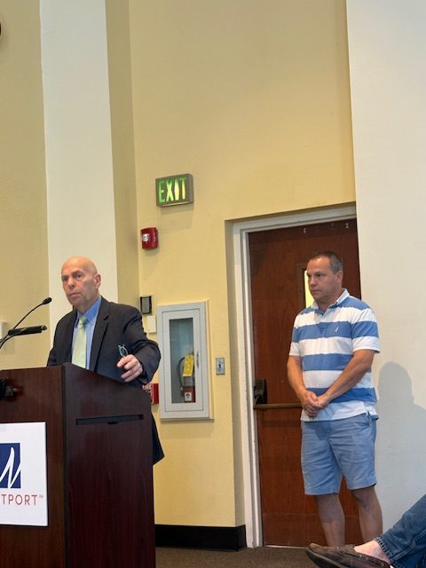 Patrick Jean, manager of Nômade Restaurant waits his turn while Alan Cohen of ElixirSpa is at the podium - Photo Gretchen Webster