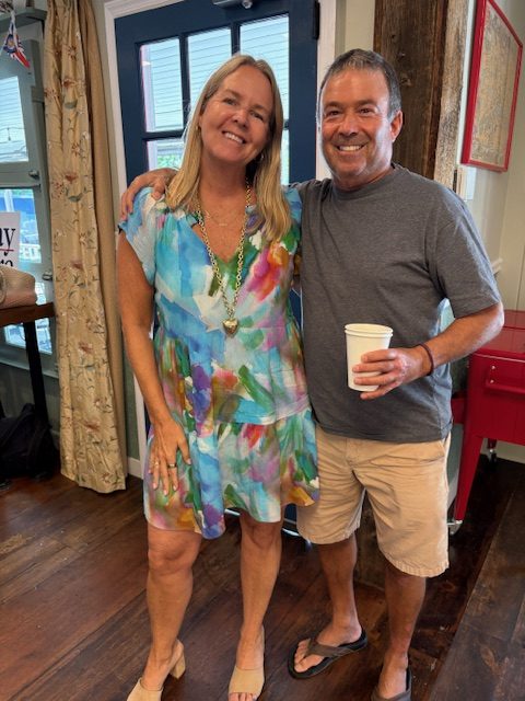 Andrea Moore, candidate for second selectwoman, is greeted by Jimmy Izzo, a long-time RTM member.