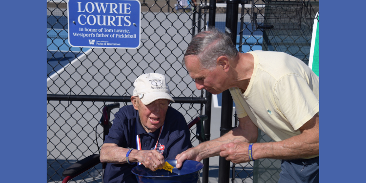 Rob Hauck and Tom Lowrie draw raffle tickets