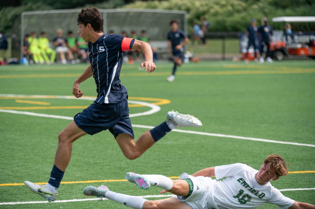 Gabe Duque evades an Enfield tackle - Photos Ryan Allen