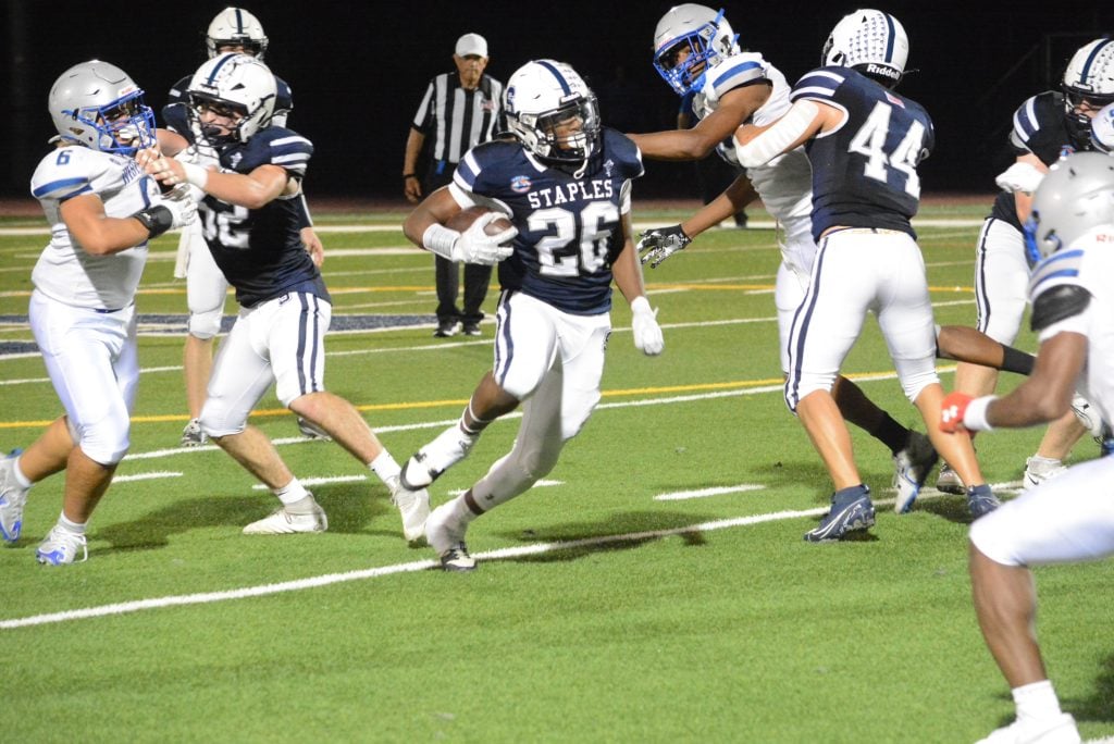 Chaz Darby was a force carrying the ball in Staples' dramatic 34-33 win over West Haven on Friday.