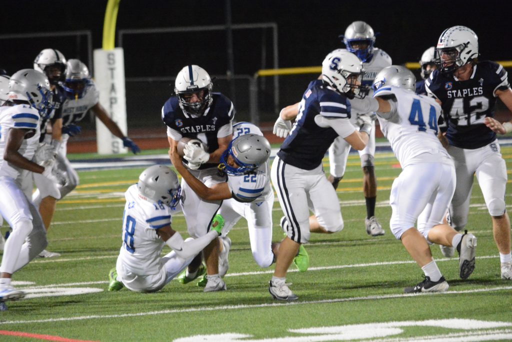 Justin Halky carries the ball. Halky made his biggest impact on special teams with a pair of extra point blocks.