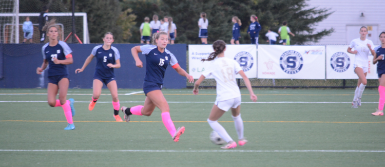 Maddie Johnson (15), Sienna Schwartz (5) and Riely Gullans (27) - Photo Andy Hutchison