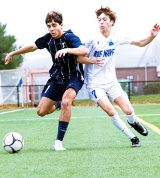 Gabe Duque shields and controls the ball – Photo John Walker