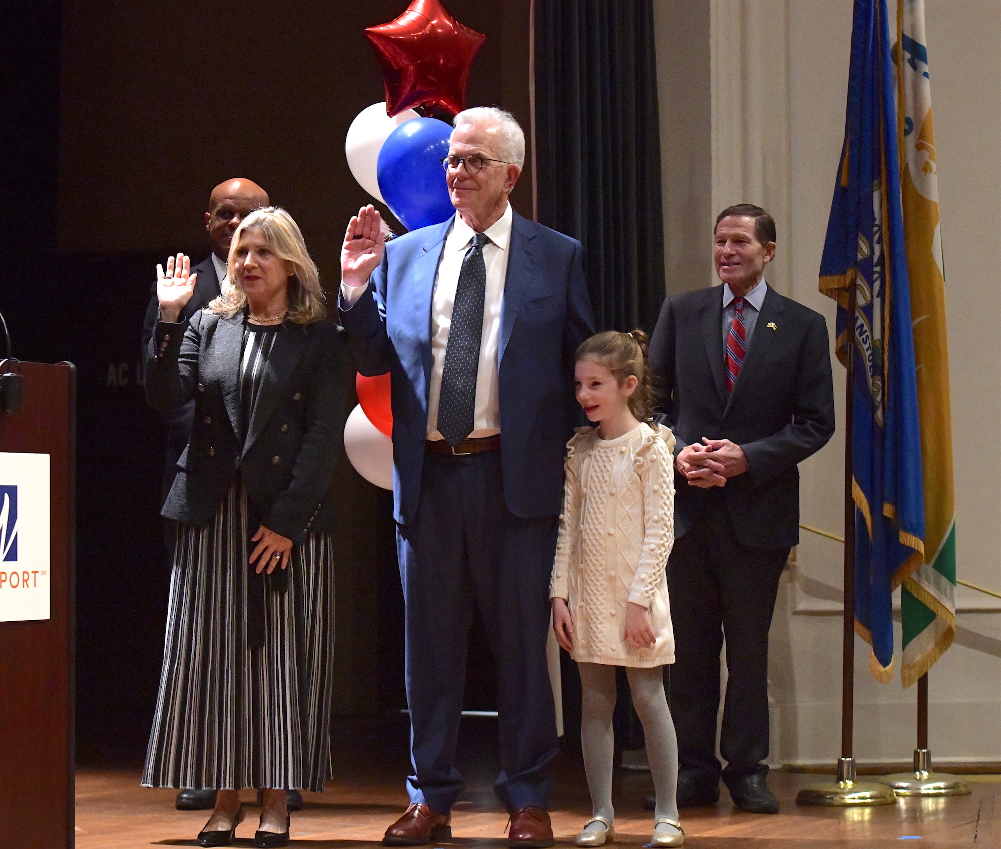 The swearing in of the second selectwoman, Amy Wistreich, and third selectman Don O'Day, accompanied by his granddaughter Reese O'Day.