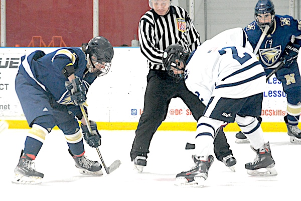 Jakub Laskovsky, right, takes a faceoff last winter. Laskovsky scored a hat-trick in a 4-1 win over JBWA - Photo Andy Hutchison