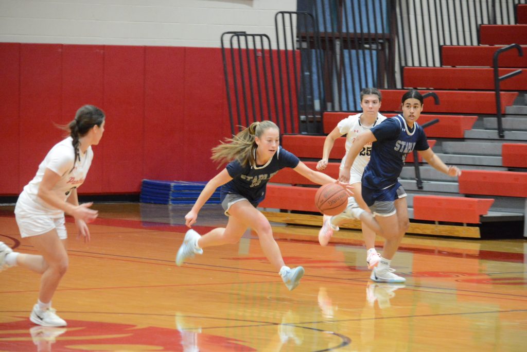 Addie Talbott dribbles up the court as Freya Harvey joins the play - Photo Andy Hutchison