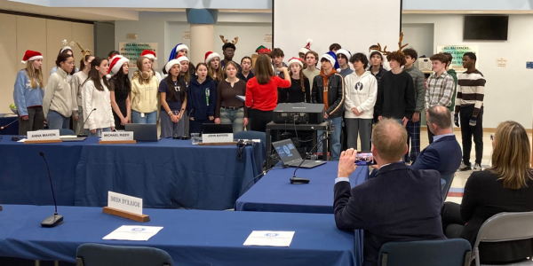 Orphenians serenade the Board of Education