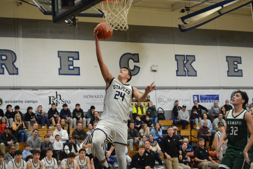 Sam Clachko soars to the rim for two of his 14 points - Photo Andy Hutchison