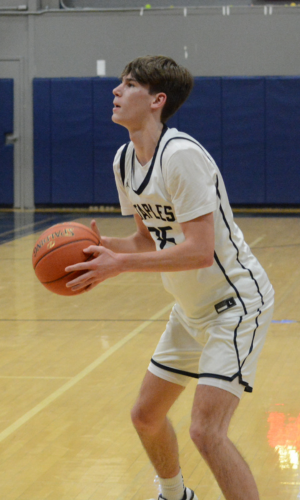 Matty Corrigan lines up a shot from long range during a home game this winter. Corrigan racked up 28 points in a road win over New Canaan on Tuesday - Photo Andy Hutchison (1)