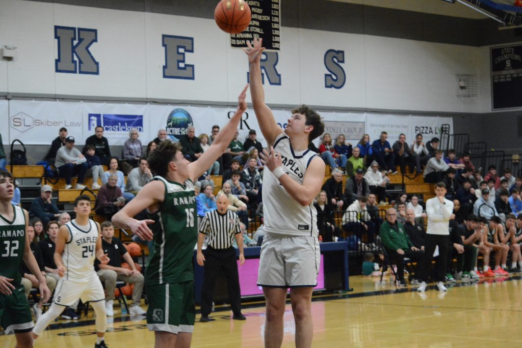 Mason Tobias puts up a shot attempt in a home game this winter. Tobias racked up 24 points at Darien on Tuesday - Photo Andy Hutchison