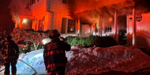 Heavy smoke billows from facade
