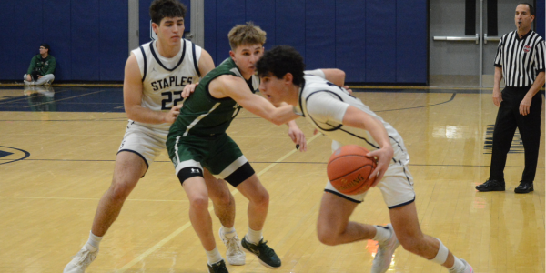 Dhilan Lowman dribbles as Jack Jacob joins the play during a home game this winter. The Wreckers will look to polish off an unbeaten regular season against Ridgefield - Photo Andy Hutchison