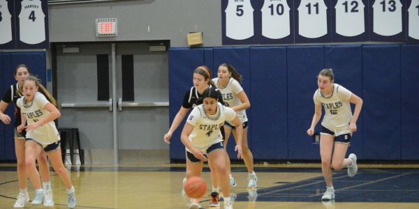 Freya Harvey and teammates Addie Talbott, left, Chloe Smith and Marley Belzer, right head up the court - Photo Andy Hutchison