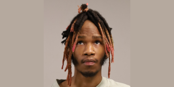 Driver jumps curb and retaining wall, endangers workers, police say