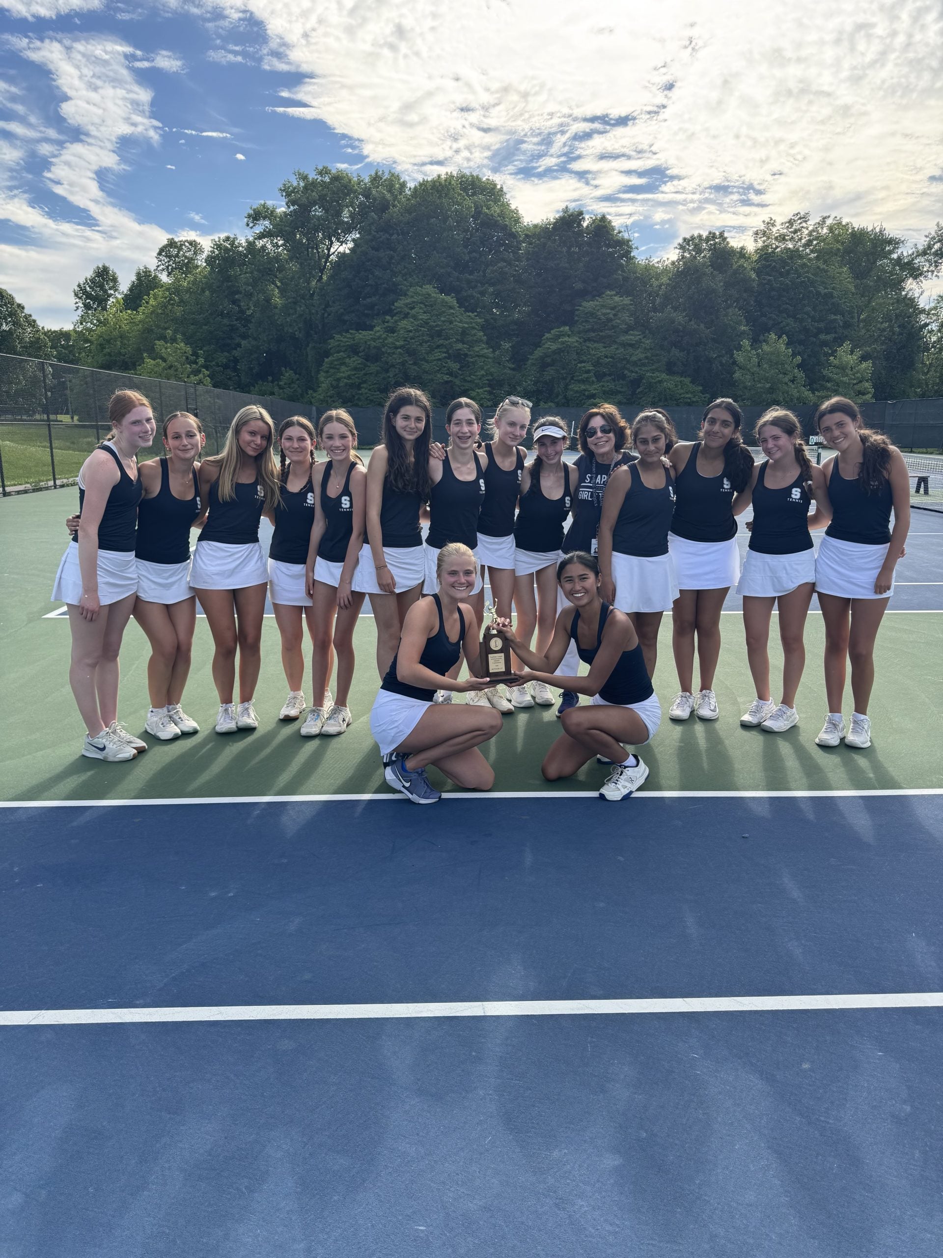 The Staples tennis team with the runner-up conference trophy