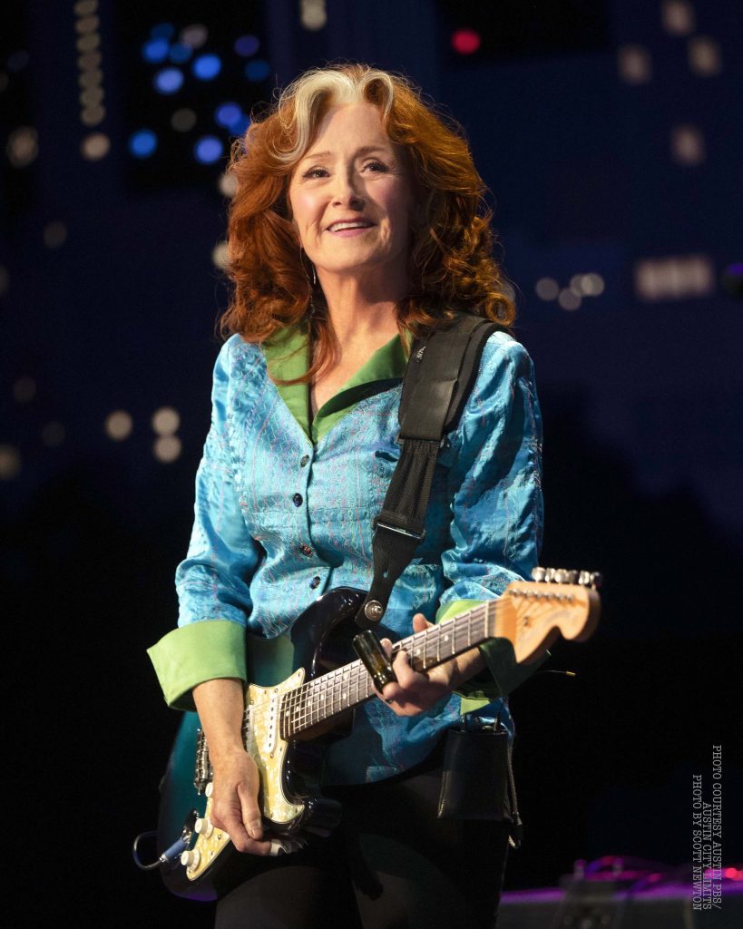 Bonnie Raitt with a blue Strat - photo by Scott Newton