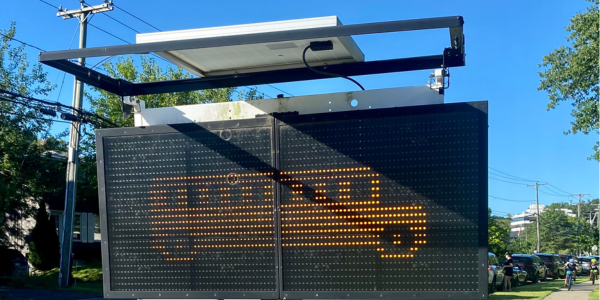 A bus safety traffic sign outside Saugatuck Elementary School
