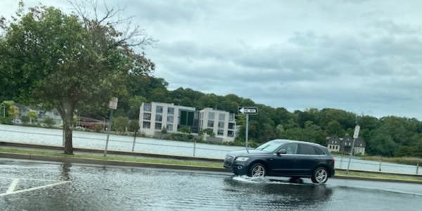 A car driving through a puddle on Parker Harding Plaza Saturday afternoon - Photo Zana Taris