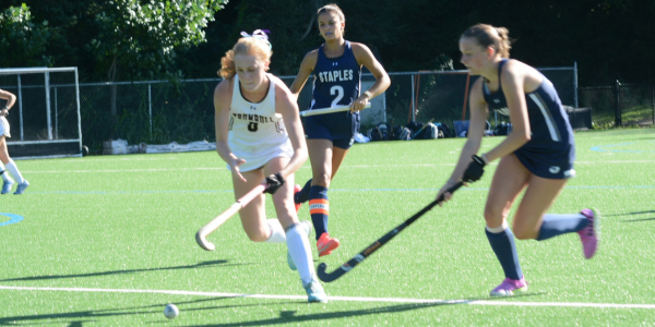 Daisy Hackett (No. 2) looks on as Izzie Schmeiser, right goes for the ball during a game this fall - Photo Andy Hutchison
