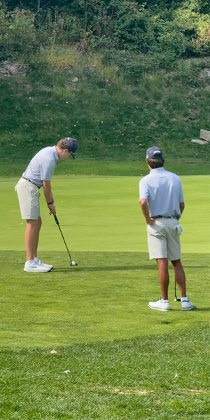 Justin Goldshore putts as Jordan Benaderet looks on at the Chappa Invitational - Photo Liam Shaw